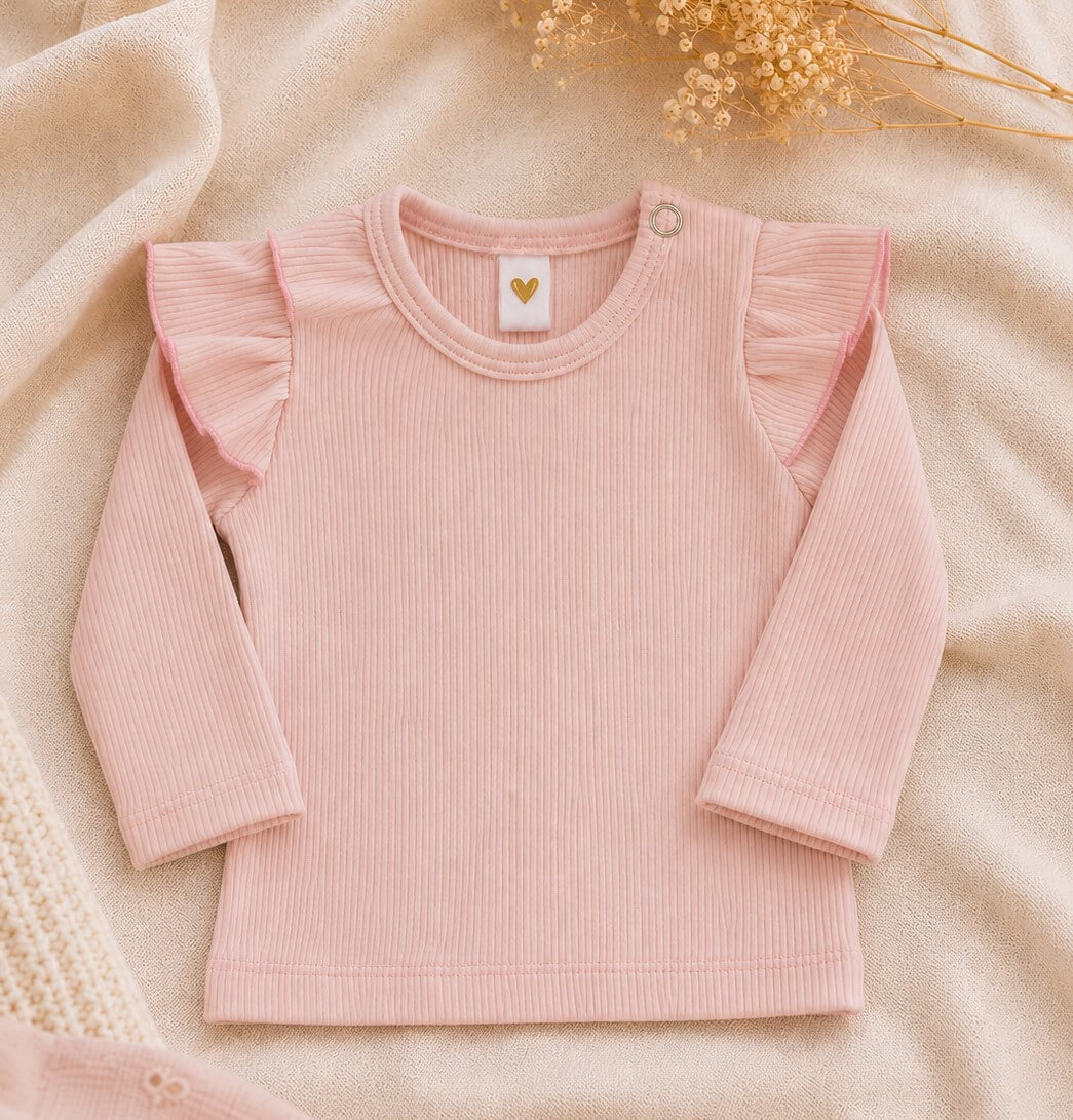 Lichtroze newborn shirtje met lange mouwen en ruffles