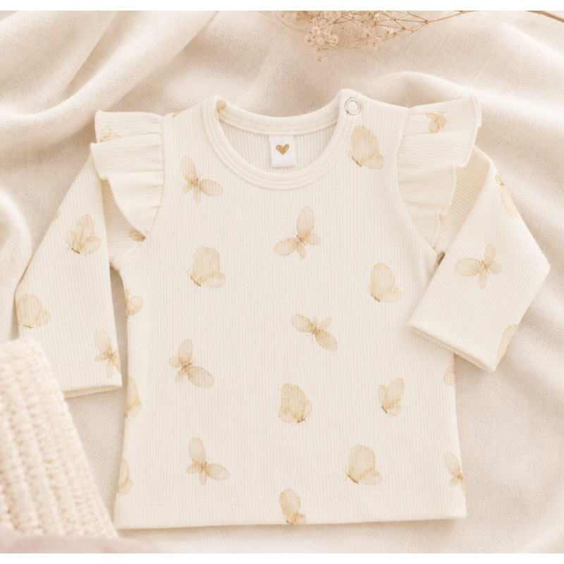 Longsleeve met witte vlinders en ruffles.